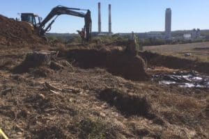 Mechanical Stripping of Grave Sites
