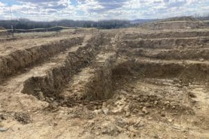 Mechanical Stripping of Grave Sites
