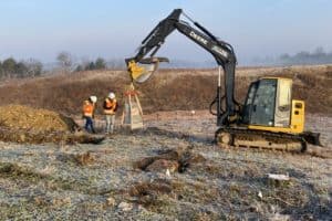 Mechanical Stripping of Grave Sites